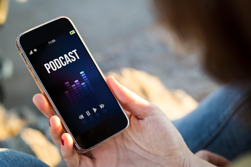 woman listening to a podcast