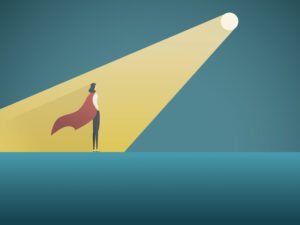 A spotlight falls on the superhero copywriter